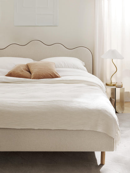 Romsen Upholstered Bed with Wavy Headboard